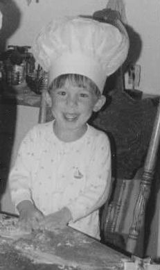 Adam Pawlak making cookies as a child.